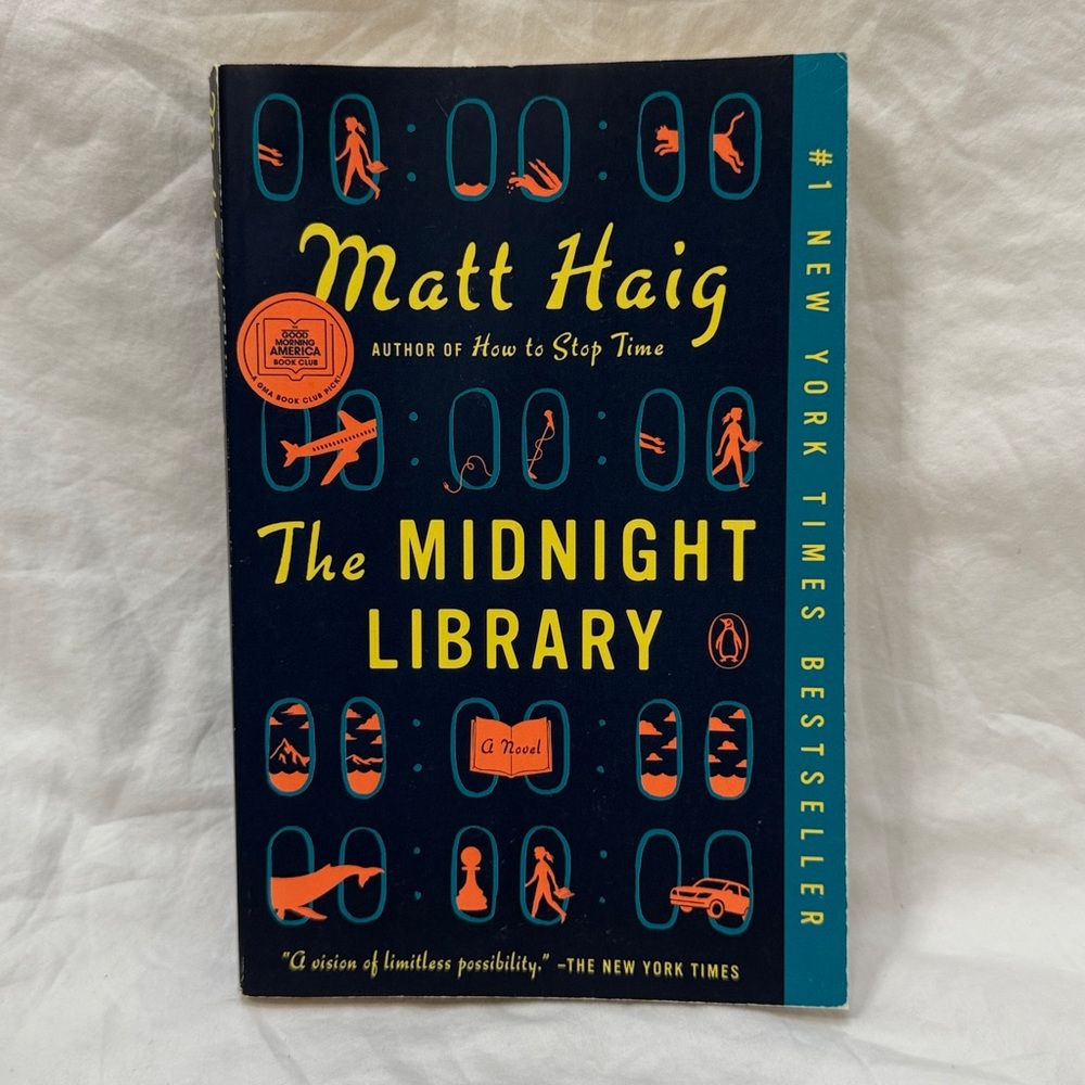 “The Midnight Library” - The Midnight World #1 Paperback Book by Matt Haig